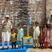 Community gathering around a new water source