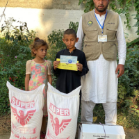 volunteer assisting widows